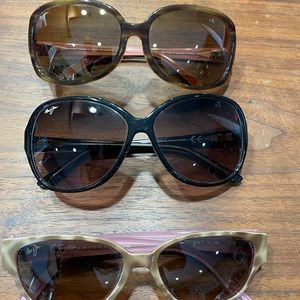 Set of three Maui Jim sunglasses.